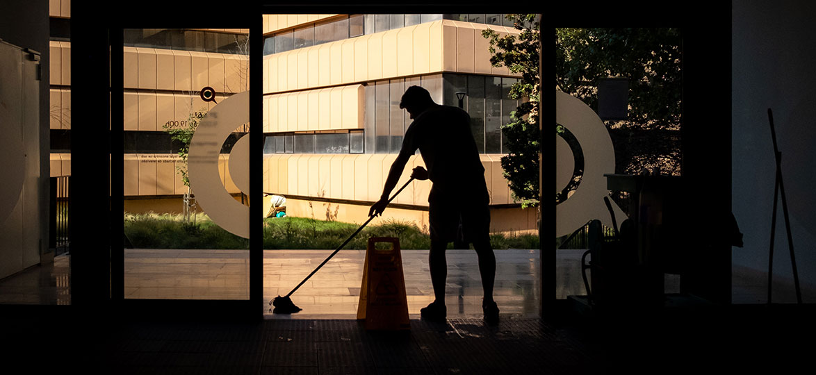 Commercial cleaner mopping an entrance floor